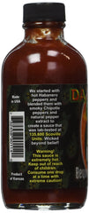 Da'Bomb sauce pouring close-up showing thick texture and concentrated heat