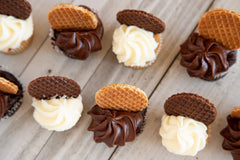 Daelmans stroopwafel warming over a hot coffee cup demonstrating softened caramel indulgence
