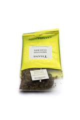 Dammann Freres close-up of a Cristal mesh sachet revealing the peppermint leaves and verbena blend