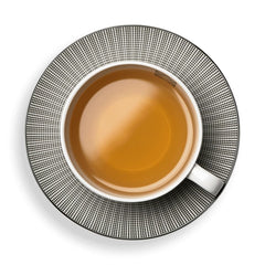 Dammann Freres box beside a teacup to show scale and single-serve portability