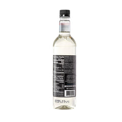 DaVinci Gourmet almond syrup being poured with steady stream for easy mixing