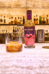 de nigris pouring over salad showing drizzle adds sweet-tart flavor benefit