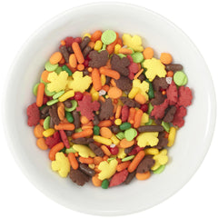 DecoPac sprinkles pouring from handheld jar demonstrating simple, controlled application