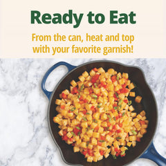 Del Monte close-up of diced potatoes and Cajun seasoning, visible texture and spice