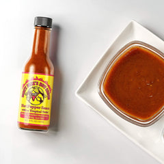 Dirty Dick's Caribbean Dream bottle detail showing mustard-forward sauce benefit: tangy finishing touch