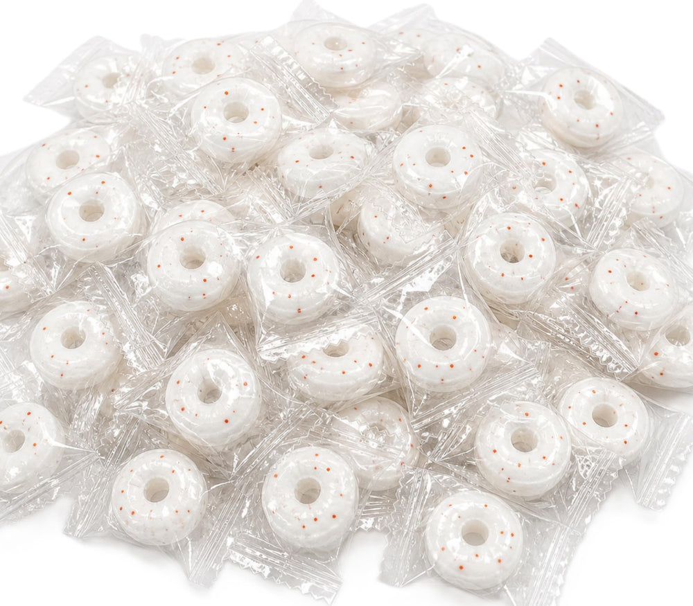 DM Sweets front of bag showing orange mints and branding, clear shelf-ready packaging benefit