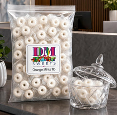 DM Sweets individually wrapped orange mint close-up, hygienic single-serve convenience benefit