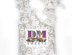 DM Sweets unwrapped orange mint showing smooth texture and glossy finish for long flavor benefit