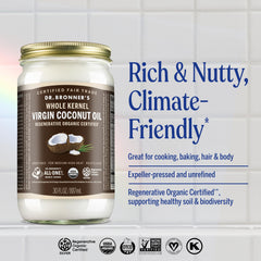 Dr. Bronner's whole kernel coconut oil open jar showing smooth unrefined texture benefit