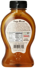 Dutch Gold honey pouring from jar into spoon with kitchen scale, demonstrates texture and serving size