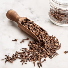 Earthborn Elements spoon portioning cloves for efficient kitchen use