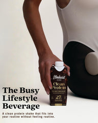Elmhurst bottle in hand to show 11-ounce scale and portability benefit