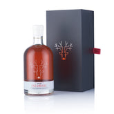 Escuminac glass bottle in gift box showing premium presentation and gifting appeal