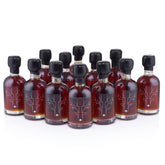 Escuminac front packaging showing twelve mini glass bottles and organic label benefit