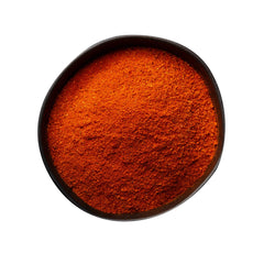 Close-up of Farmersville Spice Co Cajun powder showing texture and vibrant color