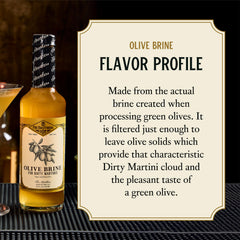 Fee Brothers olive brine used in a martini in hand, giving savory balance and classic presentation