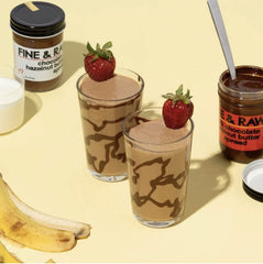 Fine & Raw spread dolloped beside strawberries showcasing fruit pairing benefit