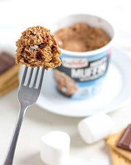 FlapJacked chocolate peanut butter muffin split open highlighting nutty filling
