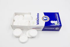 Close-up of a Wilhelmina peppermint tablet showing texture for controlled flavor release