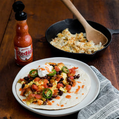Frank's RedHot close-up label highlighting aged cayenne peppers and heritage