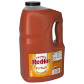 Frank's RedHot front label on 1-gallon bottle showing brand and bold Buffalo flavor benefit