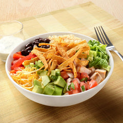Fresh Gourmet salad topped with strips adding crunch and flavor appeal