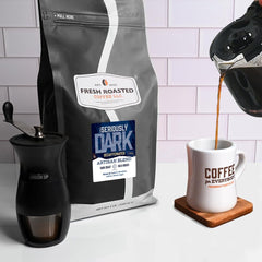 Fresh Roasted Coffee whole beans texture close-up showing dark roast sheen and rich aroma