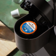 Fresh Roasted Coffee open K-Cup showing coffee grounds and water-process freshness