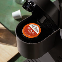 Fresh Roasted Coffee pod inserted in Keurig brewer demonstrating quick brew