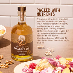 Fresh Vintage Farms walnut oil pouring from bottle, demonstrating smooth texture and finishing use