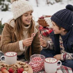 Fruidles candy cane in hand showing 2-inch size for easy portioning