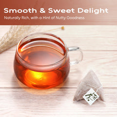FullChea tea bag steeping in a mug producing a warm amber cup quickly