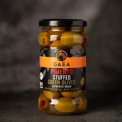 GAEA jar beside spoon showing olive size for portion and serving convenience