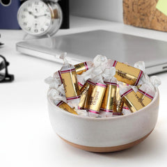 GEEOOLLAH caramels in hand showing piece size and convenient single-serve benefit