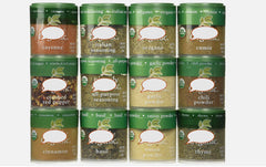 Generic brand spices in use on kitchen counter, small bottles open for cooking convenience and freshness