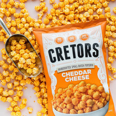 G.H. Cretors close-up of cheese-coated kernels highlighting rich cheddar coverage