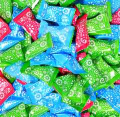 Gift Boutique close-up of papel picado styled wrappers adding festive color