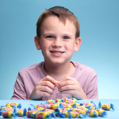 Global Gumball scattered pieces showing quantity and size comparison