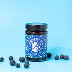 Good Good spoon with raspberry jam showing thick texture and richness