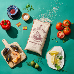 Paella pan cooking with Gourmanity rice showing even absorption and rich color benefit