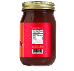 Green Jay Gourmet jam on spoon over toast, showcasing smooth texture and flavorful spreadability