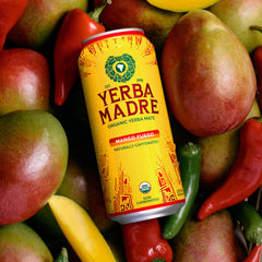Guayaki Mango Fuego splash with mango pieces highlighting real fruit flavor