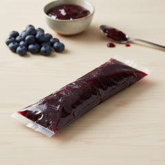 Hampton Distribution 2 lb squeeze bag beside ruler for scale helps buyers visualize portion size