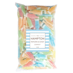 The Hampton Popcorn Company nik-l-nips next to a ruler showing bottle size for scale