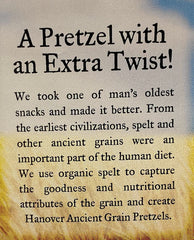 Hanover spelt pretzels with sea-salt crystals visible, enhanced savory flavor benefit