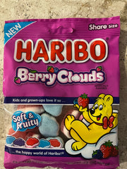 Hand holding Haribo Berry Clouds pouch to show scale and convenient single-serve size