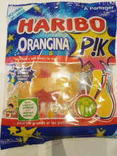Haribo front packaging showing bottle-shaped orange gummies and bright colors, appealing display
