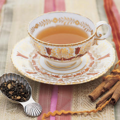 Harney & Sons poured cup in kitchen setting demonstrating warm spiced tea enjoyment and serving ease