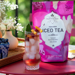 Harney & Sons glass of iced tea garnished with lemon and mint, bright presentation