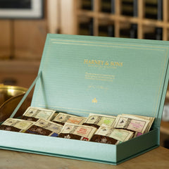 Harney & Sons teal chest next to ruler for scale, highlighting compact, refillable organization